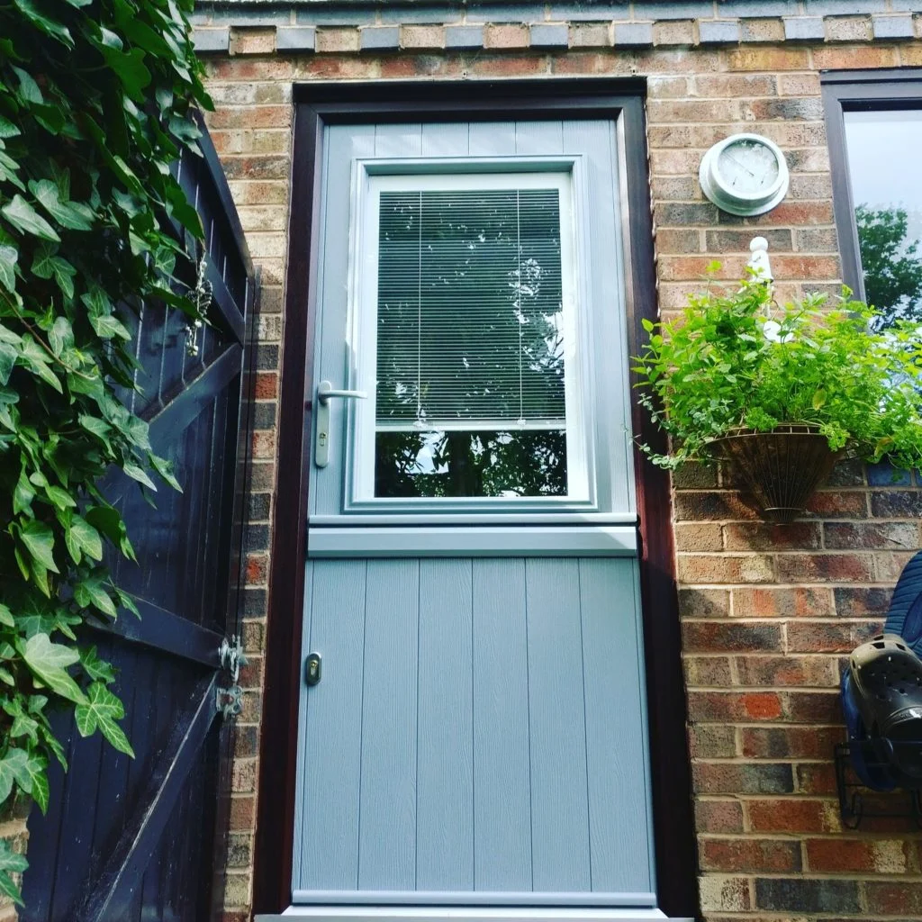 Glazed door with an integral blind sealed inside the glass
