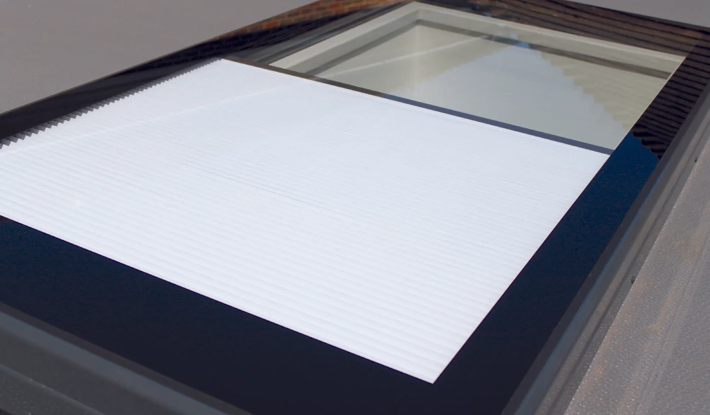 Close-up of an integrated rooflight blind inside the glazed unit