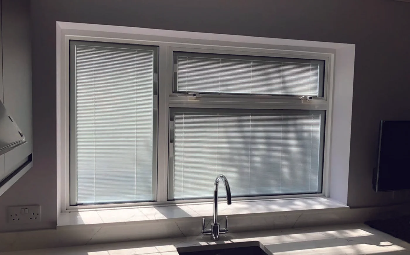 Flush-style window opening with integral blinds inside the glazed units
