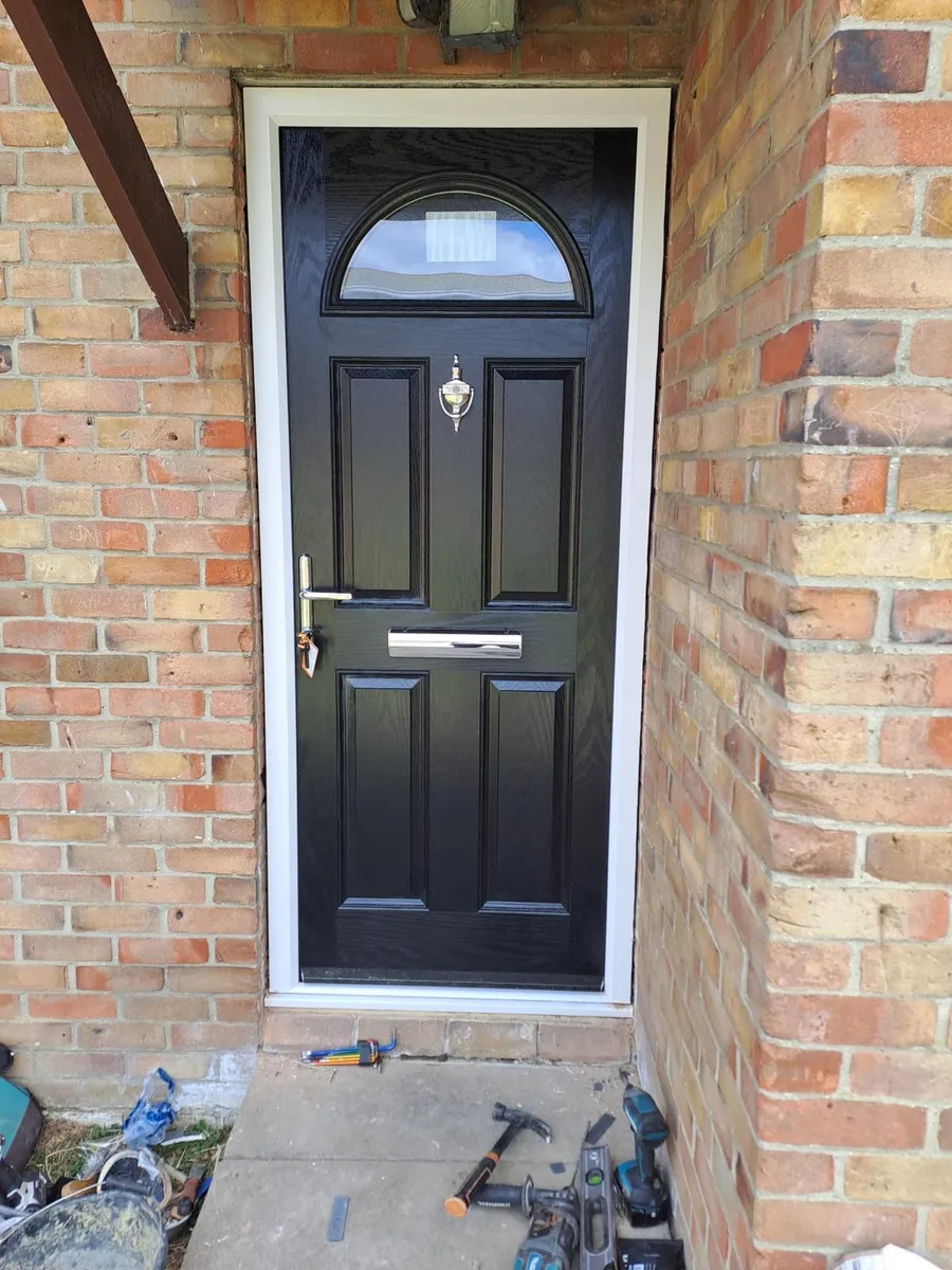 Black Composite Doors, exterior view during installation in Chigwell by Cii Double Glazing